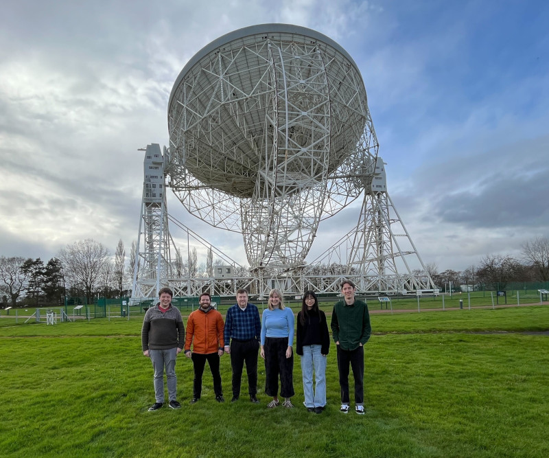 (Left to right:) Phil, Mike, Hugh, Katrine, Isabelle, and Jacob in front of the Lovell Telescope at Jodrell Bank.