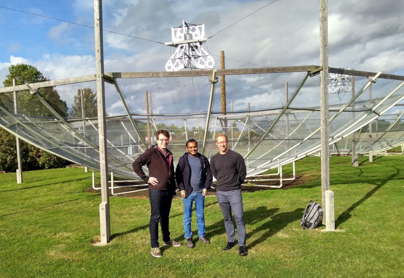 Phil, Samir, and Fraser in front of one of the HERA test dishes at Lord's Bridge, near Cambridge.