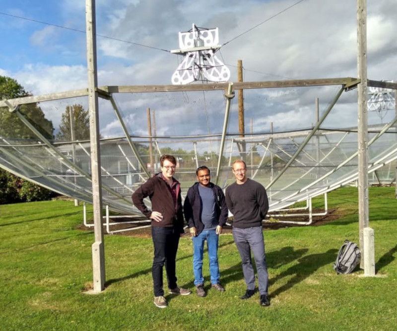 Phil, Samir, and Fraser in front of one of the HERA test dishes at Lord's Bridge, near Cambridge.